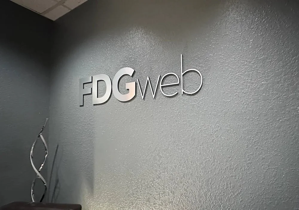 fdg web logo inside of the office on the wall